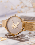 goldene Armbanduhr mit 3D Vogel auf dem Ziffernblatt und passenden Armband