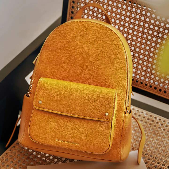 Mustard yellow leather outlet backpack