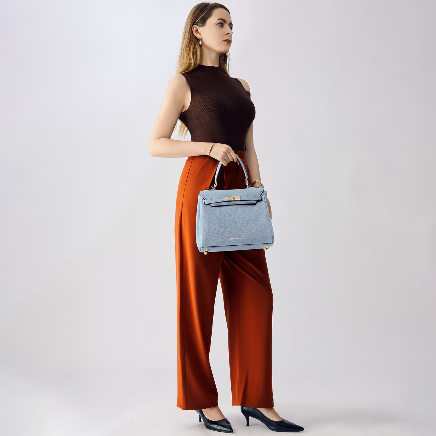 Elegant ash-blue Victoria Hyde handbag: vegan PU leather, light gold details, 3-in-1 carry style. Spacious interior with organized pockets. Lightweight &amp; regal.