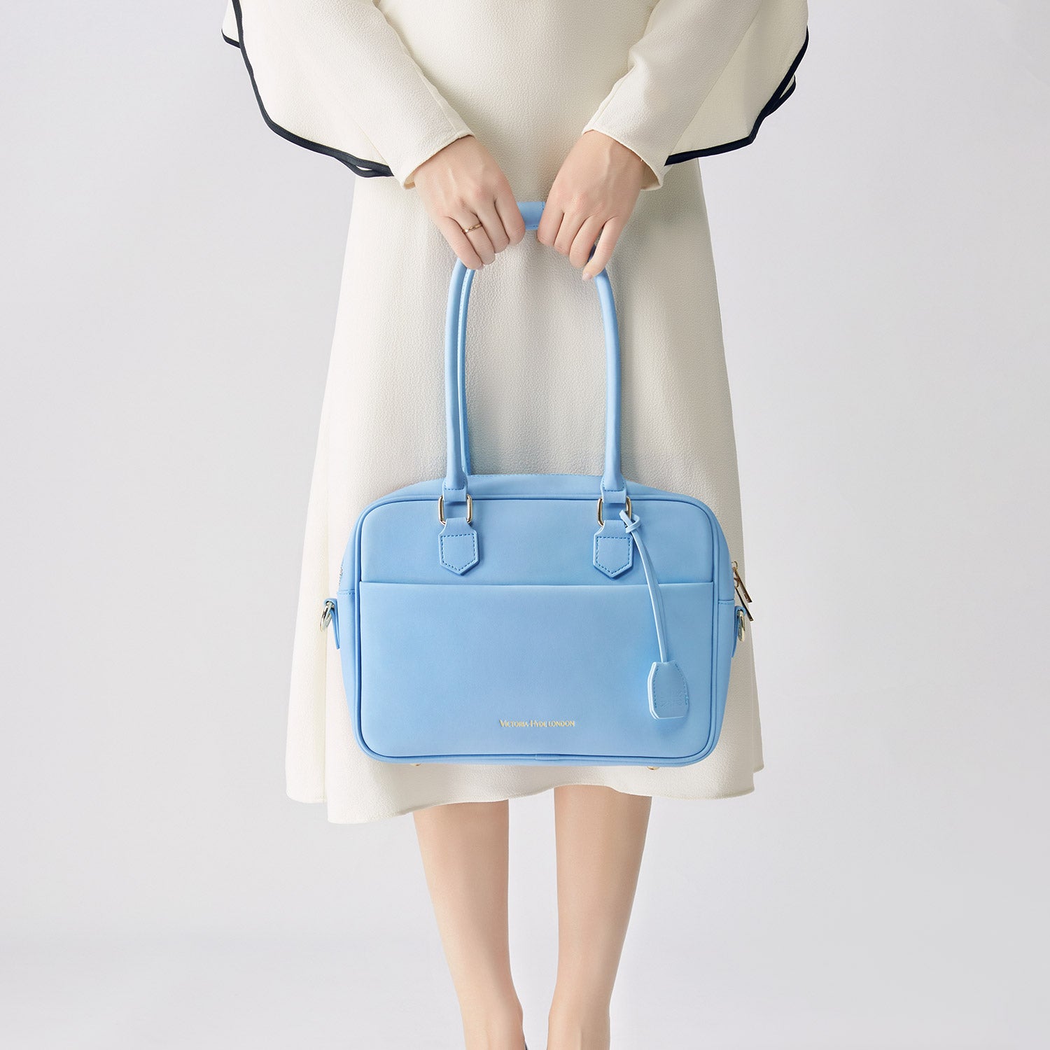 Light blue Victoria Hyde work bag: vegan, water-resistant, scratchproof microfiber leather. Fits 12.9" tablet/laptop. Smart interior + removable cosmetic bag. Perfect for commuting &amp; professional women.