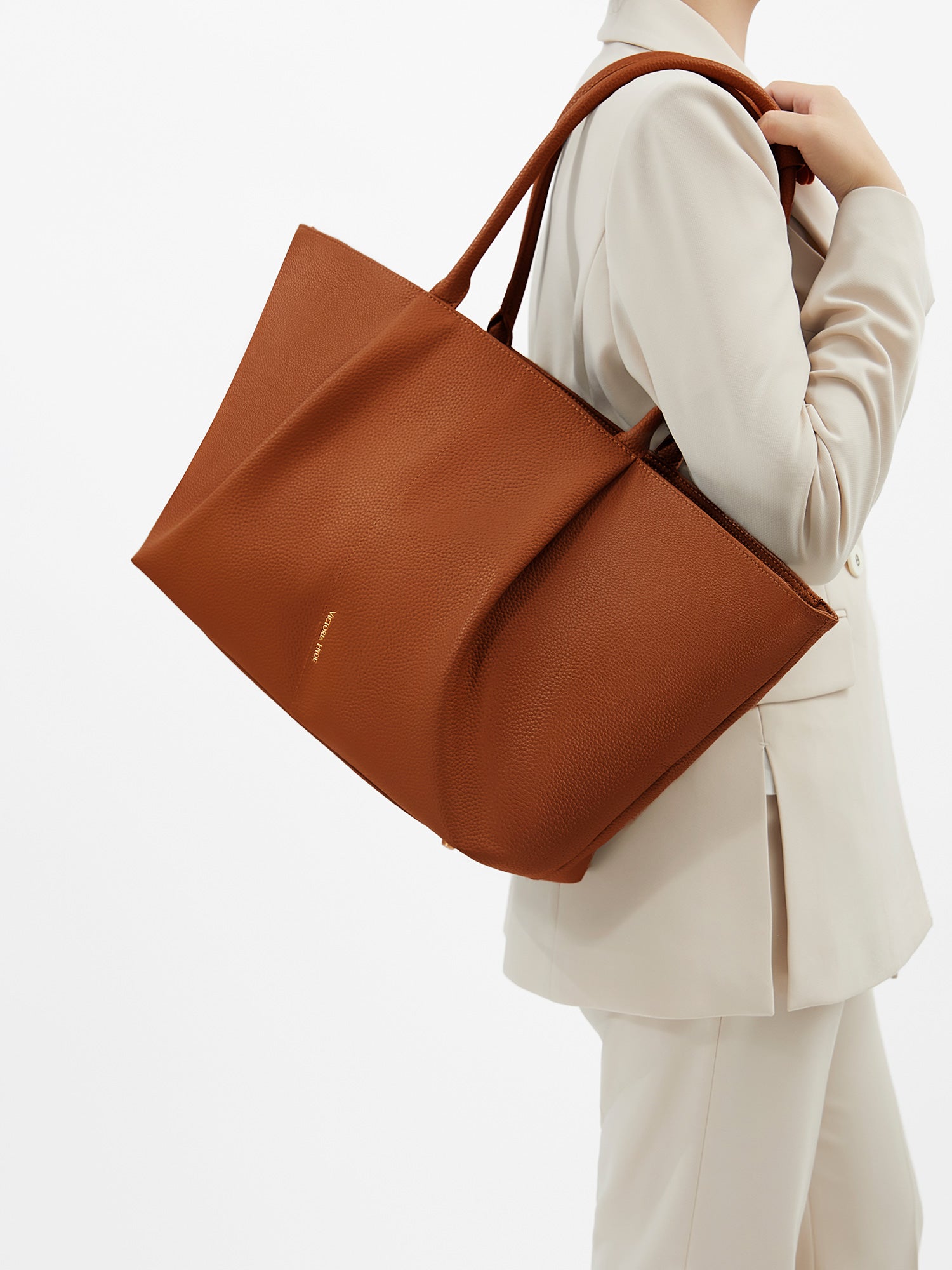 Victoria Hyde Ada laptop handbag in brown, vegan leather business tote with 16-inch laptop compartment and trolley sleeve