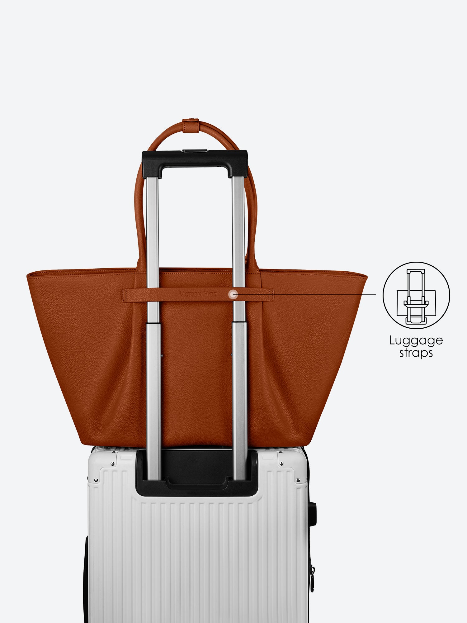 Victoria Hyde Ada brown laptop bag with luggage strap, easily attaches to trolley handles for convenient travel, stylish business bag for commuters.