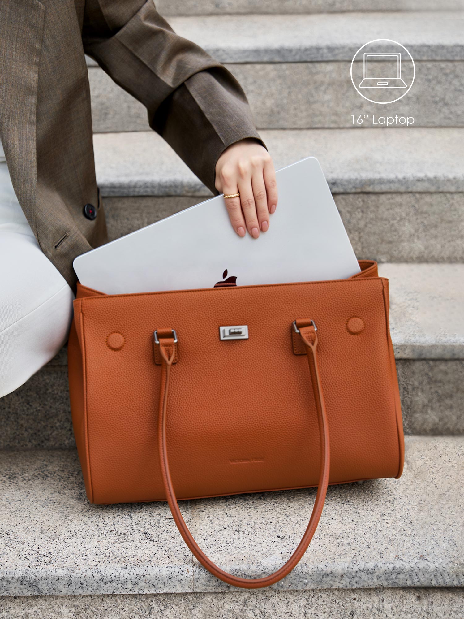 Victoria Hyde Jolene brown laptop bag perfectly fitting a 16-inch laptop, demonstrating secure and easy access for professional daily commutes.