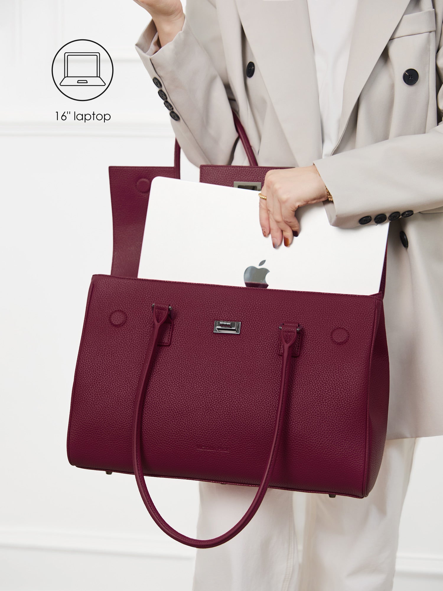 Victoria Hyde Jolene winered laptop bag perfectly fitting a 16-inch laptop, demonstrating secure and easy access for professional daily commutes.