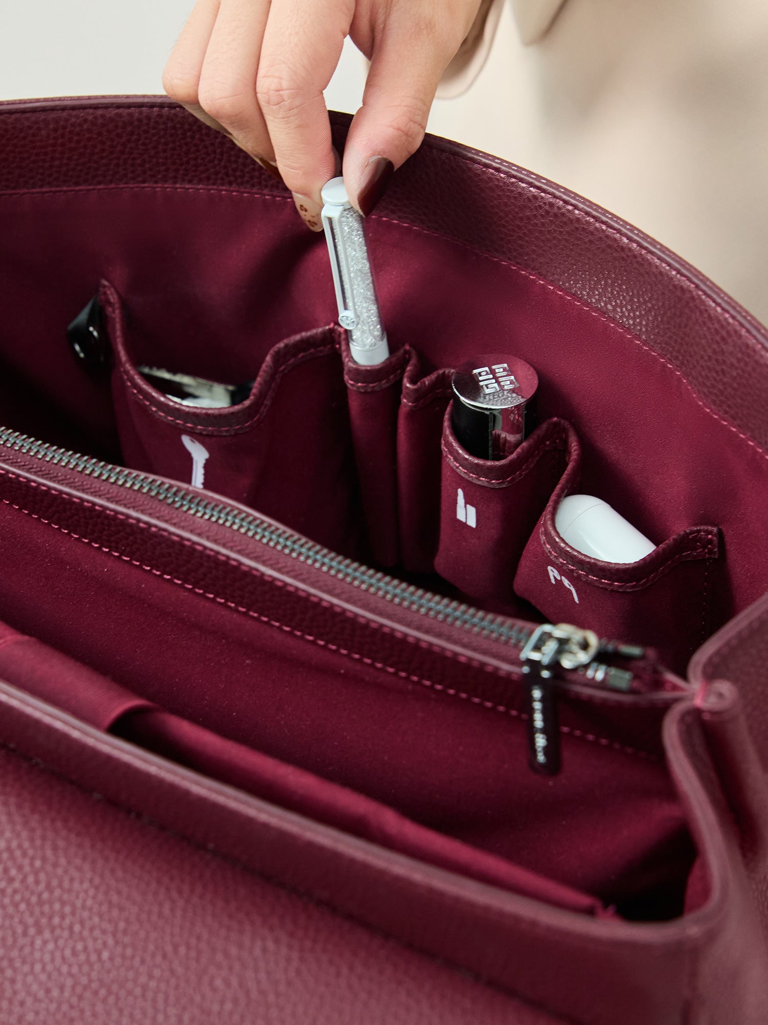 Victoria Hyde Jolene winered laptop bag interior showing organized pockets for smartphone, pens, and accessories, perfect for daily business essentials.