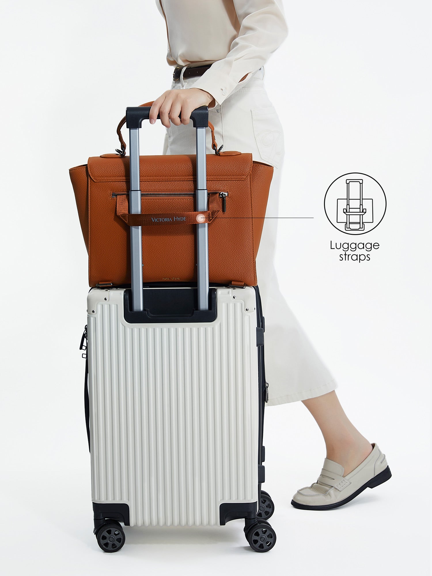 Victoria Hyde Potter braun laptop bag with luggage strap, easily attaches to trolley handles for convenient travel, stylish business bag for commuters.