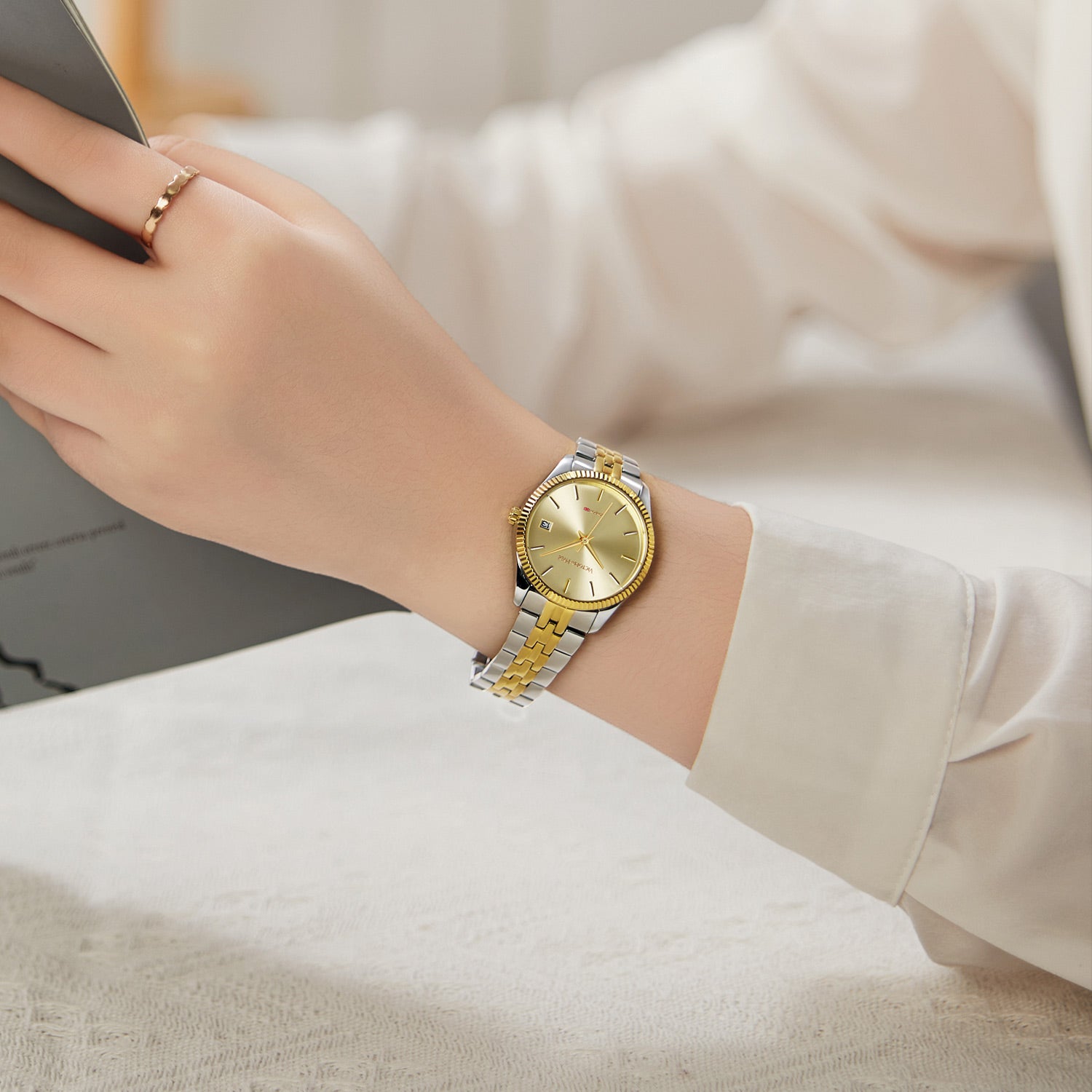 Victoria Hyde gold-silver watch with gold sunburst dial, calendar, stainless steel band, double butterfly clasp, 32mm case, 3-year battery.