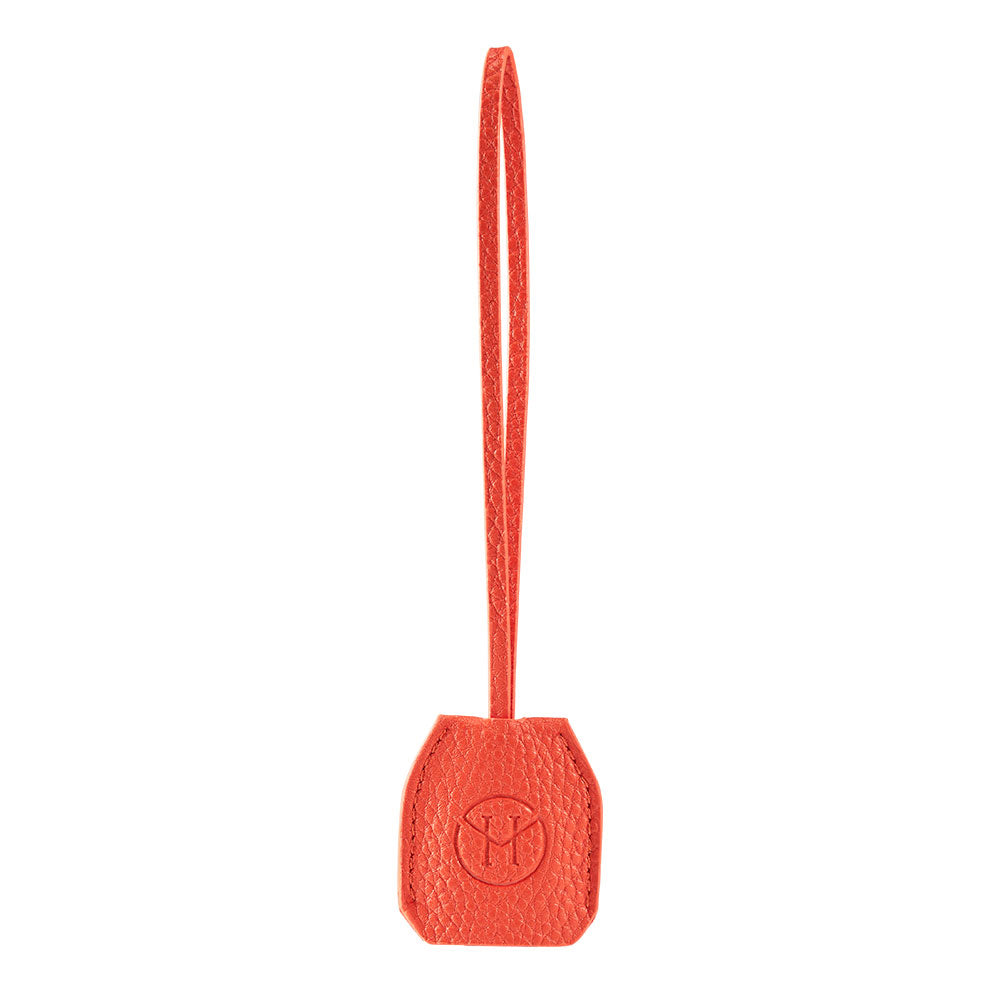 Victoria Hyde orange watch-shaped bag charm with chain. Minimalist design, subtle elegance, functional accessory. Pendant size 40x47 mm. Perfect for timeless style.