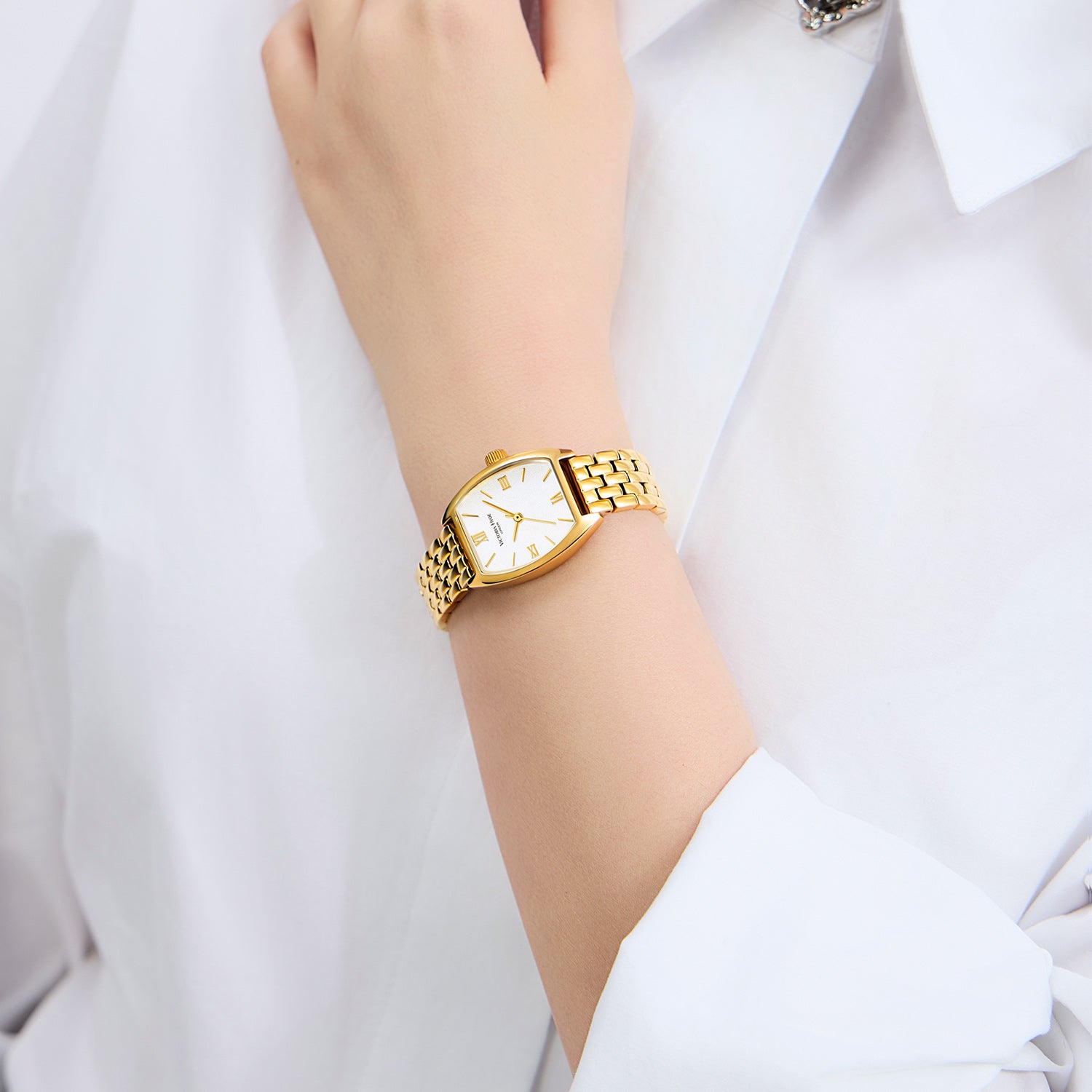 Elegant Victoria Hyde London ladies' watch, BARREL series. Light gold tonneau case, silver sand-dial, quartz movement, 3ATM water resistance.