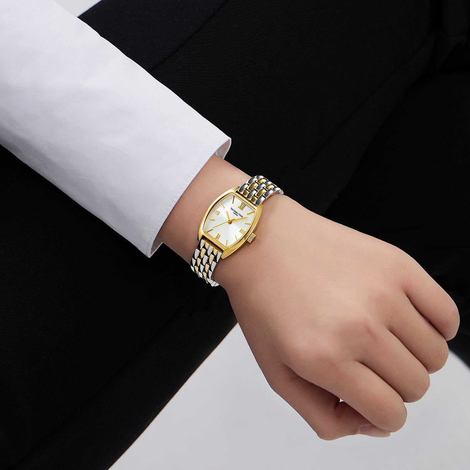 Victoria Hyde London BARREL women's watch, silver-gold tonneau copper case, sunburst dial, stainless steel bracelet with light gold accents, quartz movement.