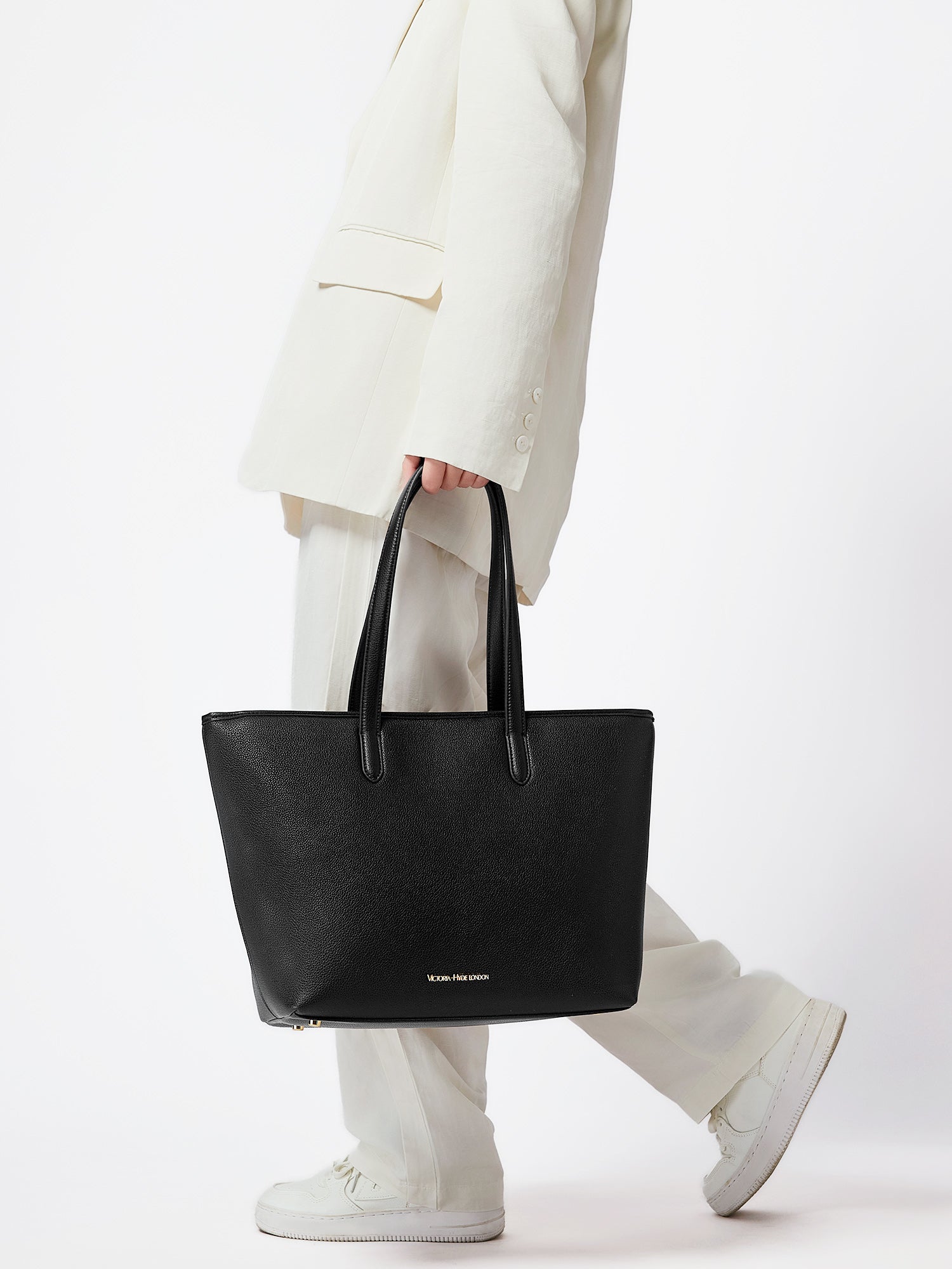 Black Yoana Large work bag by Victoria Hyde. Vegan microfiber leather, Shandong silk lining, padded 15" laptop compartment, removable cosmetic bag, water-repellent. Ideal for commuters.