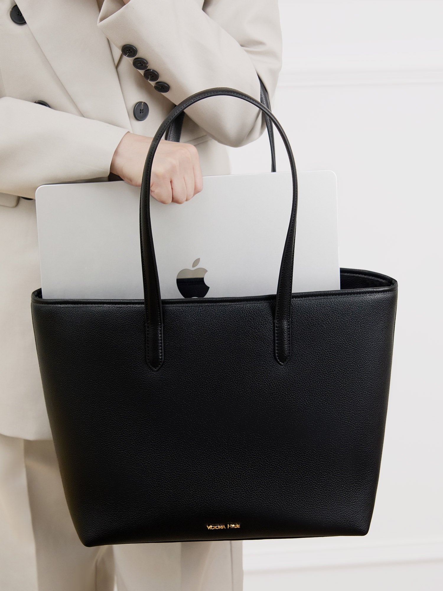Black Yoana Large work bag by Victoria Hyde. Vegan microfiber leather, Shandong silk lining, padded 15" laptop compartment, removable cosmetic bag, water-repellent. Ideal for commuters.