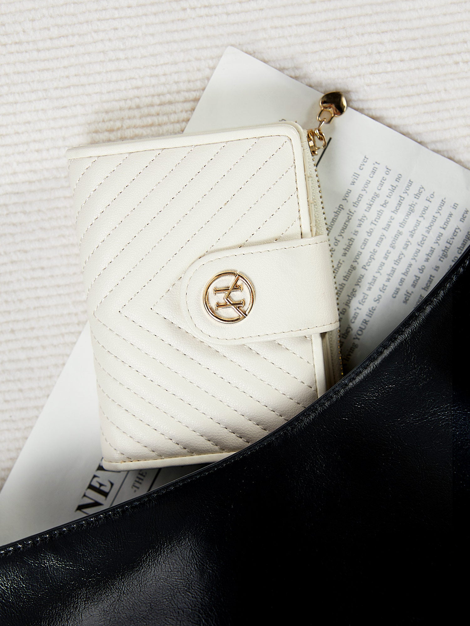 Victoria Hyde Rosi milk-white genuine leather wallet with 23 card slots, bill compartment, and zippered coin pocket. Multifunctional and elegant.