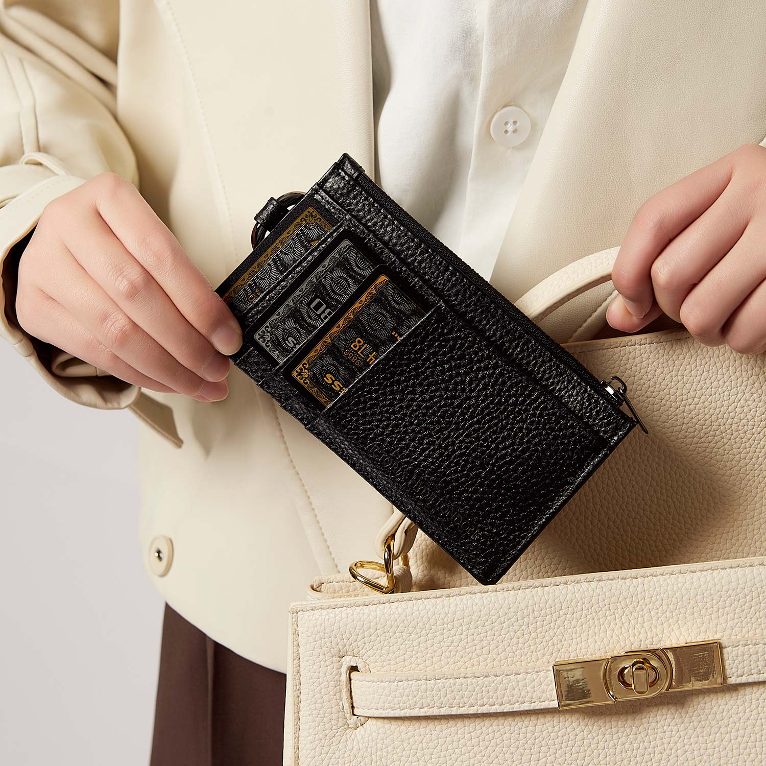 Victoria Hyde black genuine leather cardholder, unisex, multi-functional. Features 10 card slots, coin pocket, ticket slot, removable clasp. Minimalist and practical.