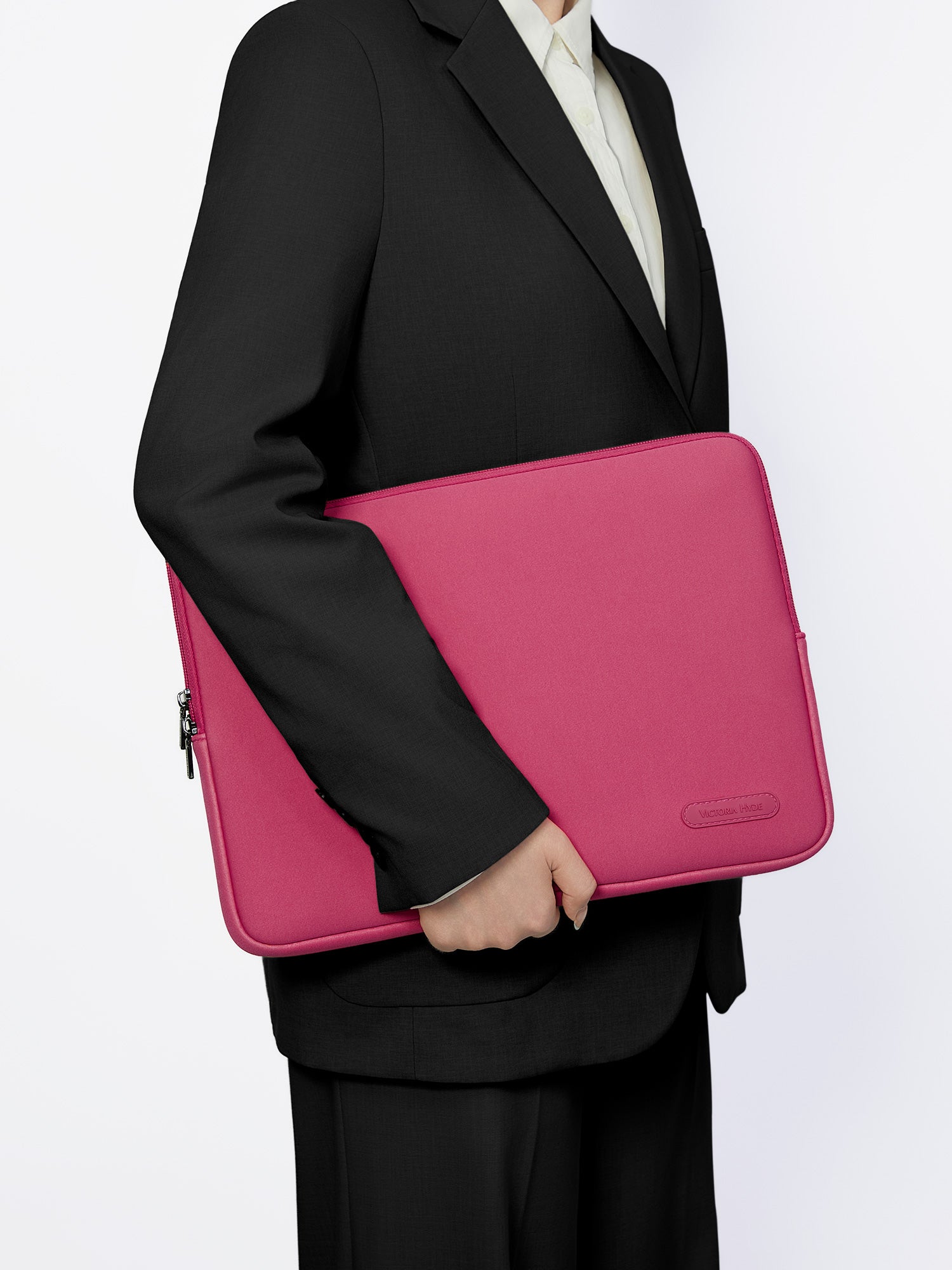 Victoria Hyde pink neoprene laptop sleeve for 13-inch laptops, 32.5x25x1.5cm, lightweight 0.2kg, zinc alloy hardware, protective and durable.