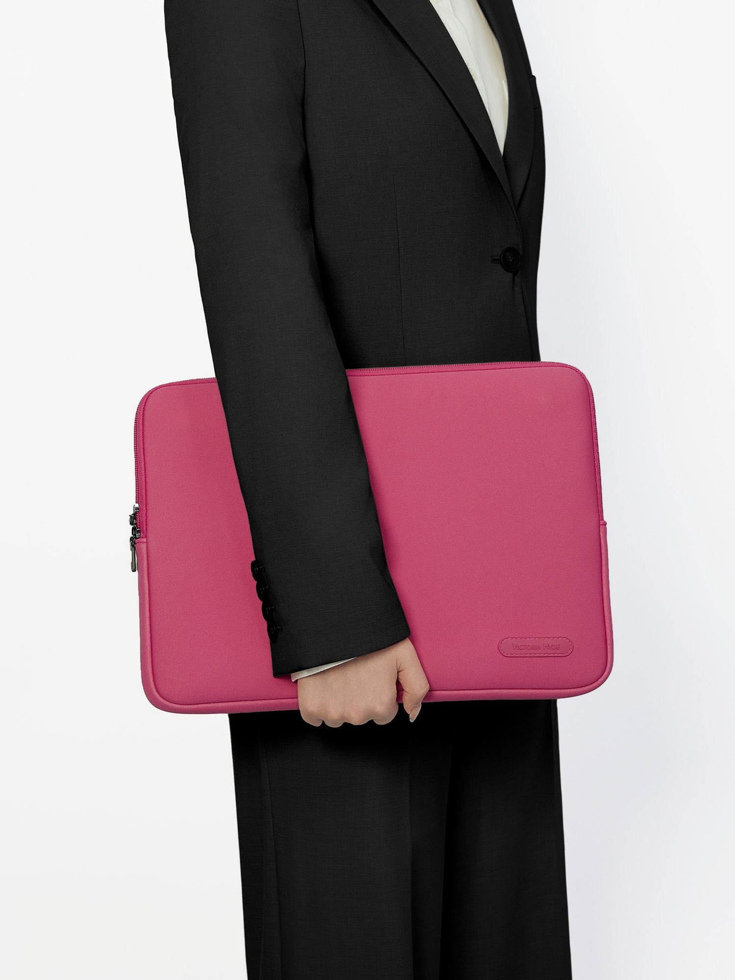 Victoria Hyde pink neoprene laptop sleeve for 13-inch laptops, 32.5x25x1.5cm, lightweight 0.2kg, zinc alloy hardware, protective and durable.