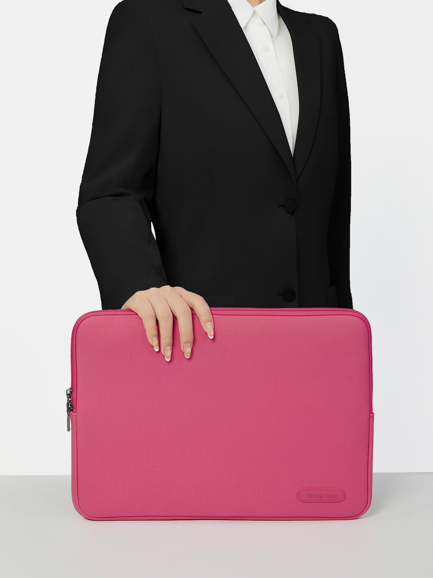 Victoria Hyde pink neoprene laptop sleeve for 13-inch laptops, 32.5x25x1.5cm, lightweight 0.2kg, zinc alloy hardware, protective and durable.