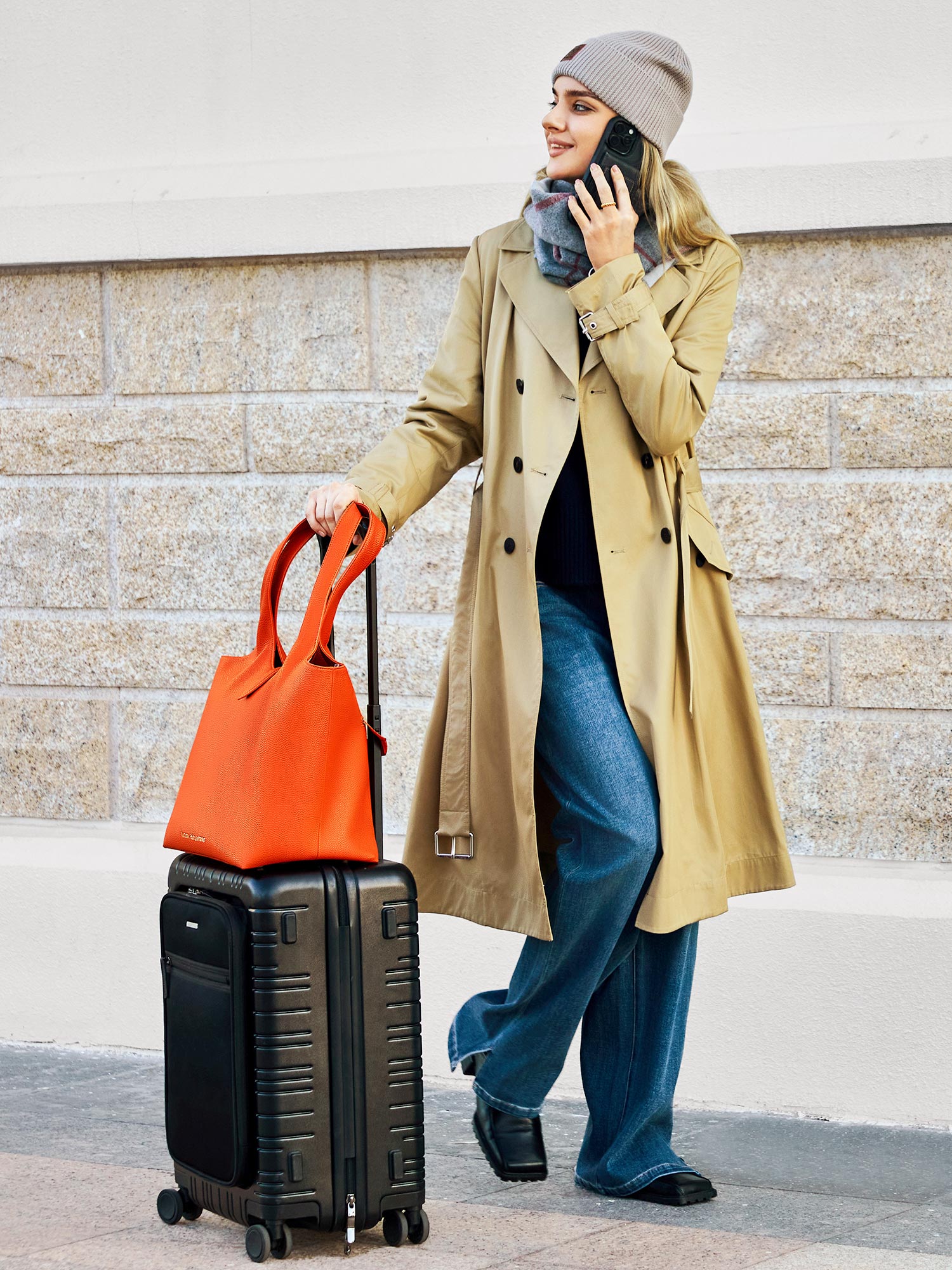 Victoria Hyde Strive Collection orange work bag with thoughtful interior pockets, removable laptop compartment, zippered back with trolley strap, durable microfiber leather, sustainable RPET lining, scratch-resistant &amp; water-repellent. Ideal for professionals.