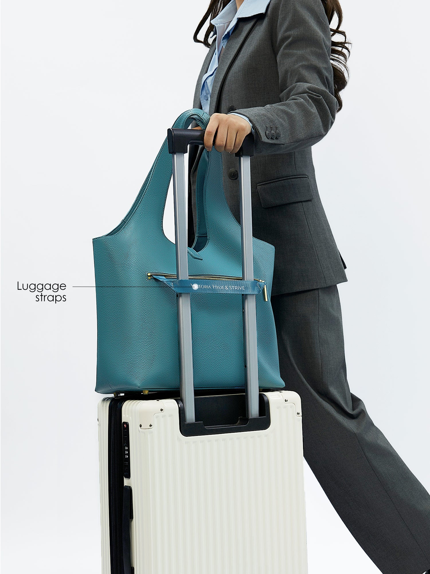 Victoria Hyde Strive Collection turquoise work bag. Microfiber leather, RPET lining. Interior pockets, removable laptop compartment, trolley strap. 0.85kg, 56x32x20 cm.