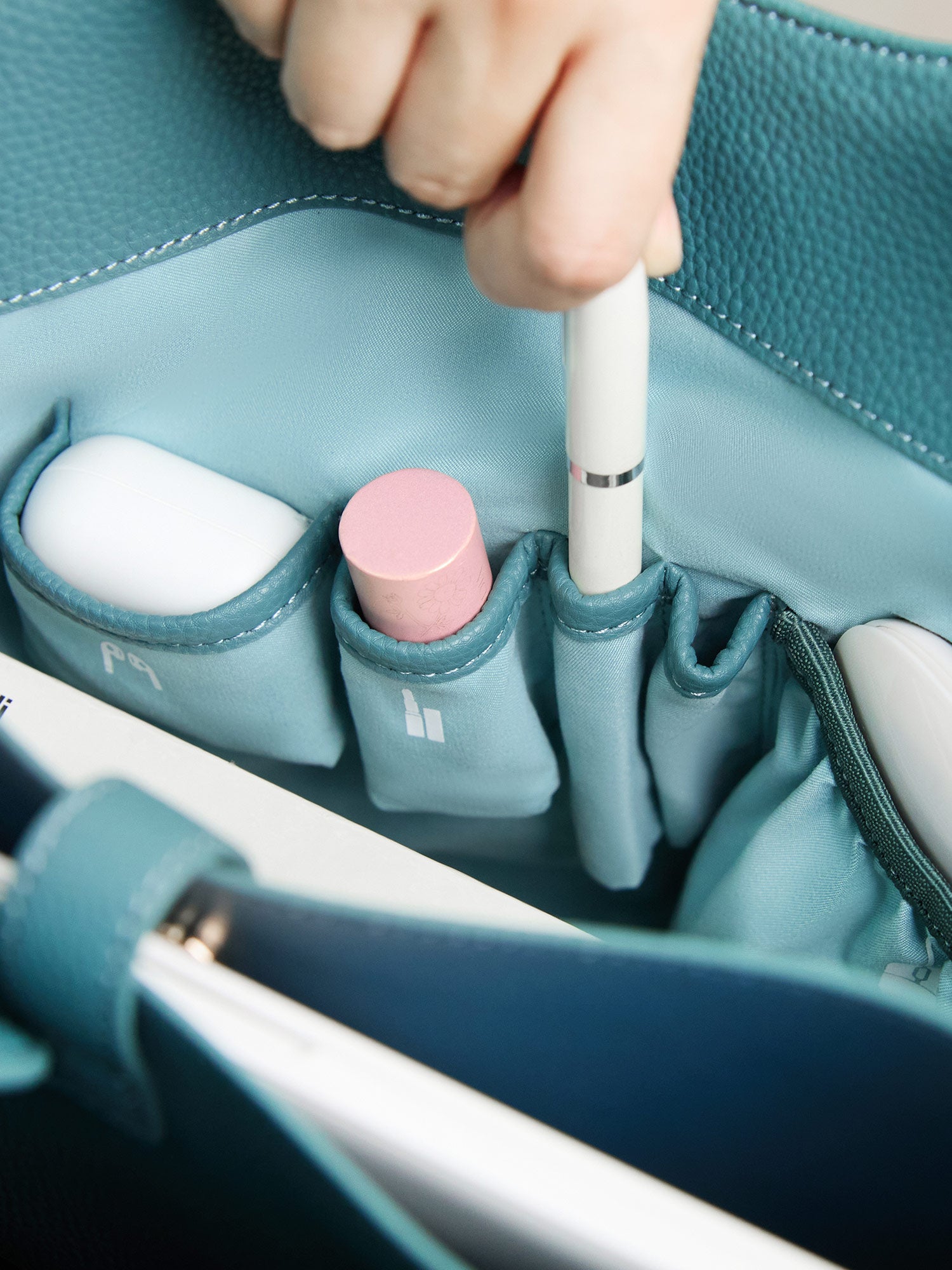 Victoria Hyde Strive Collection turquoise work bag. Microfiber leather, RPET lining. Interior pockets, removable laptop compartment, trolley strap. 0.85kg, 56x32x20 cm.