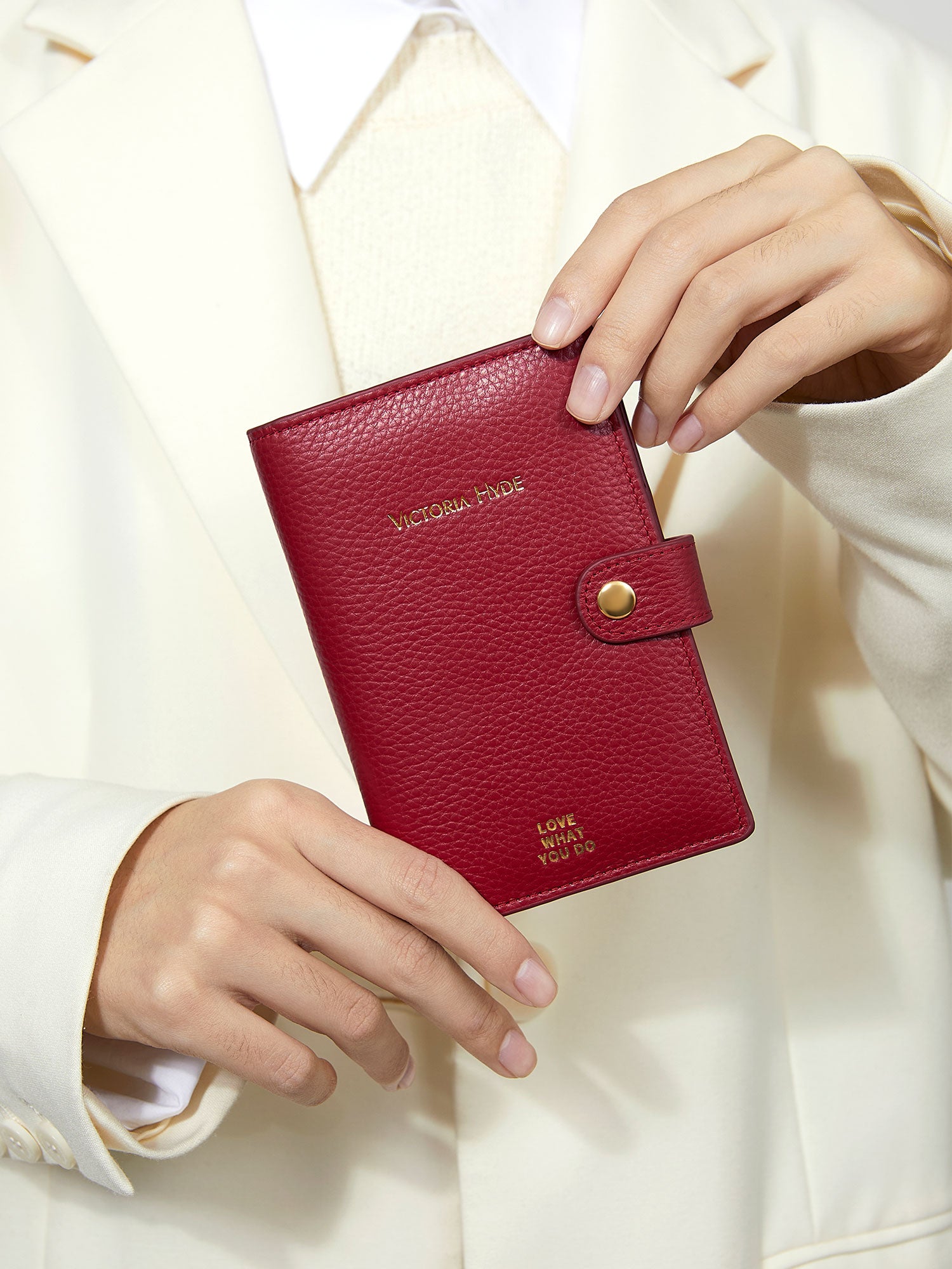 Victoria Hyde full-grain leather passport wallet with brass buckle, microfiber lining. Holds passport, boarding pass, 3 cards. Dimensions: 14 x 9.5 cm.