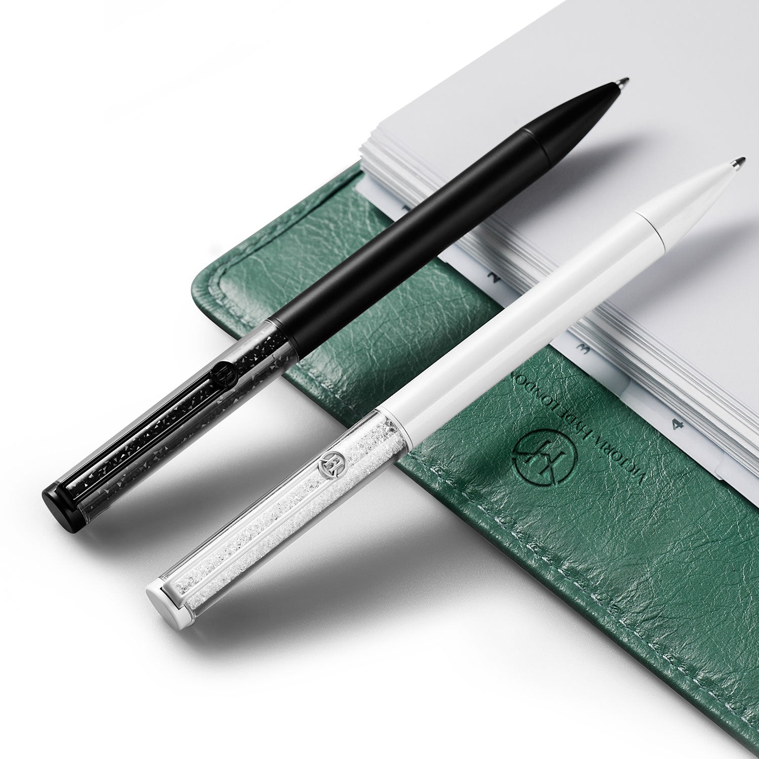 Victoria Hyde pearl white crystal ballpoint pen with imitation Swarovski stone, aluminum body, zinc clip, silver tip. Elegant writing accessory.