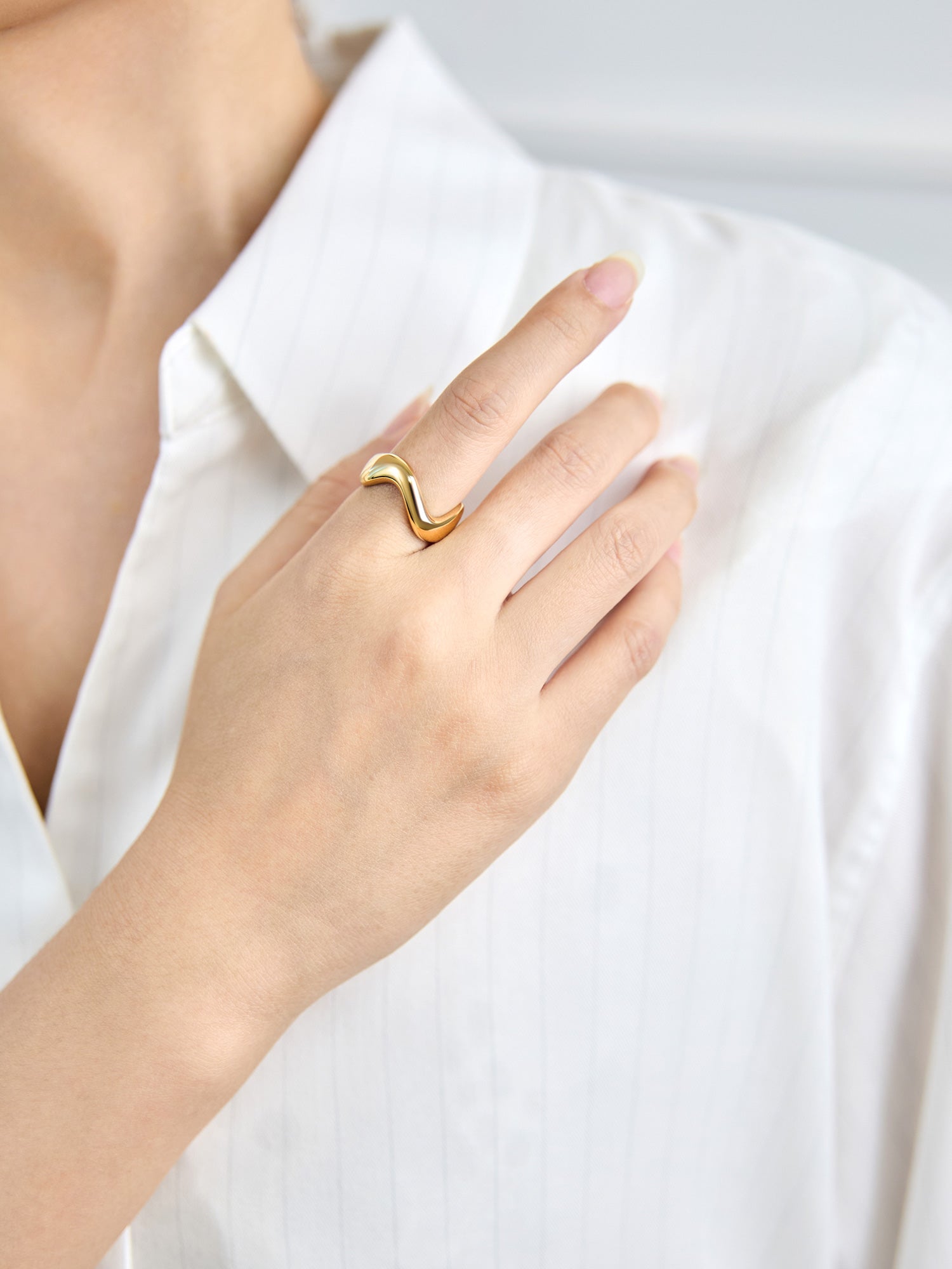 Victoria Hyde Ursula ring in 1N14 light gold, featuring an organic asymmetric design with variable width and a comfortable solid build made from eco-friendly copper for modern everyday styling