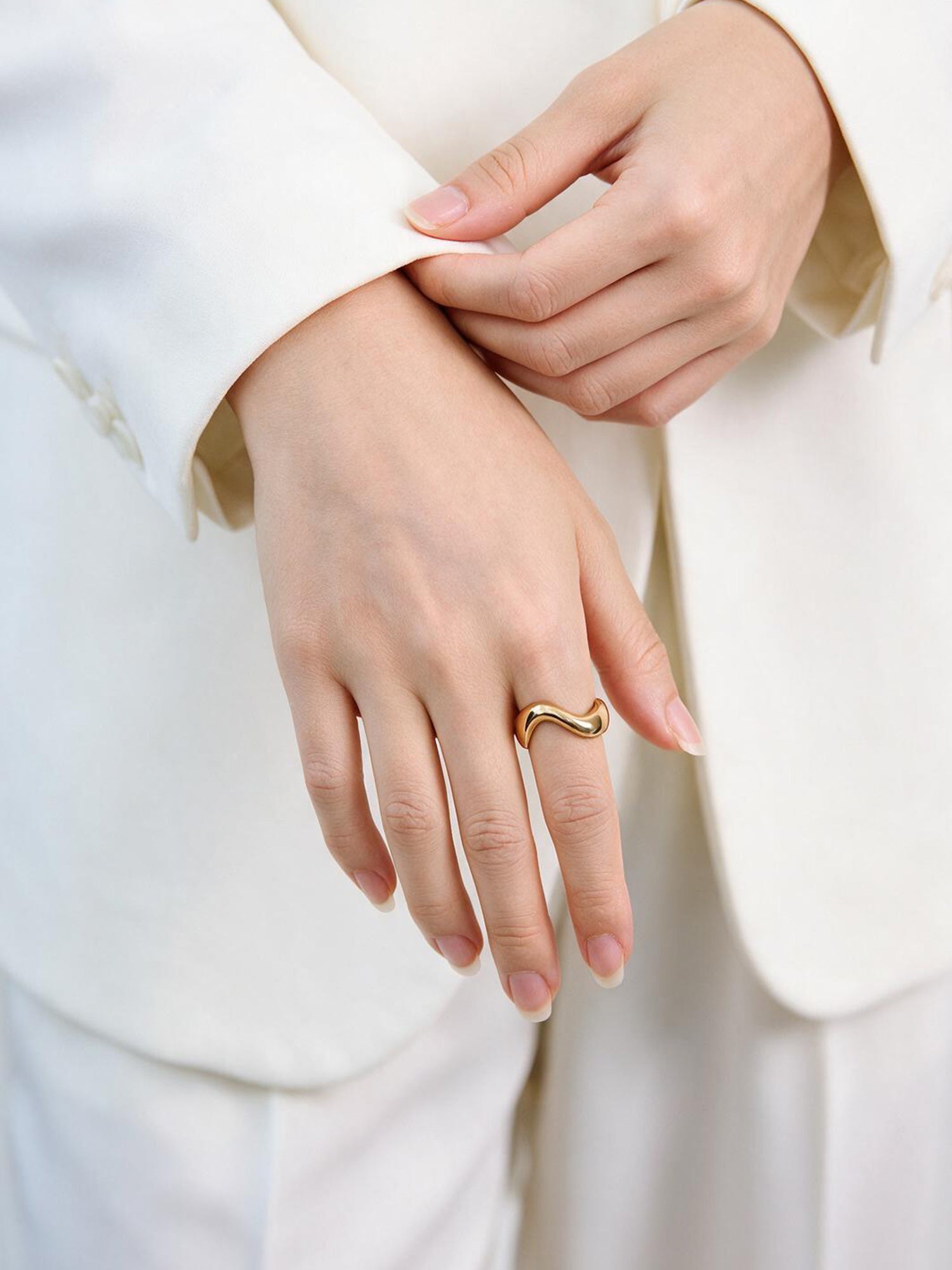 Victoria Hyde Ursula ring in 1N14 light gold, featuring an organic asymmetric design with variable width and a comfortable solid build made from eco-friendly copper for modern everyday styling