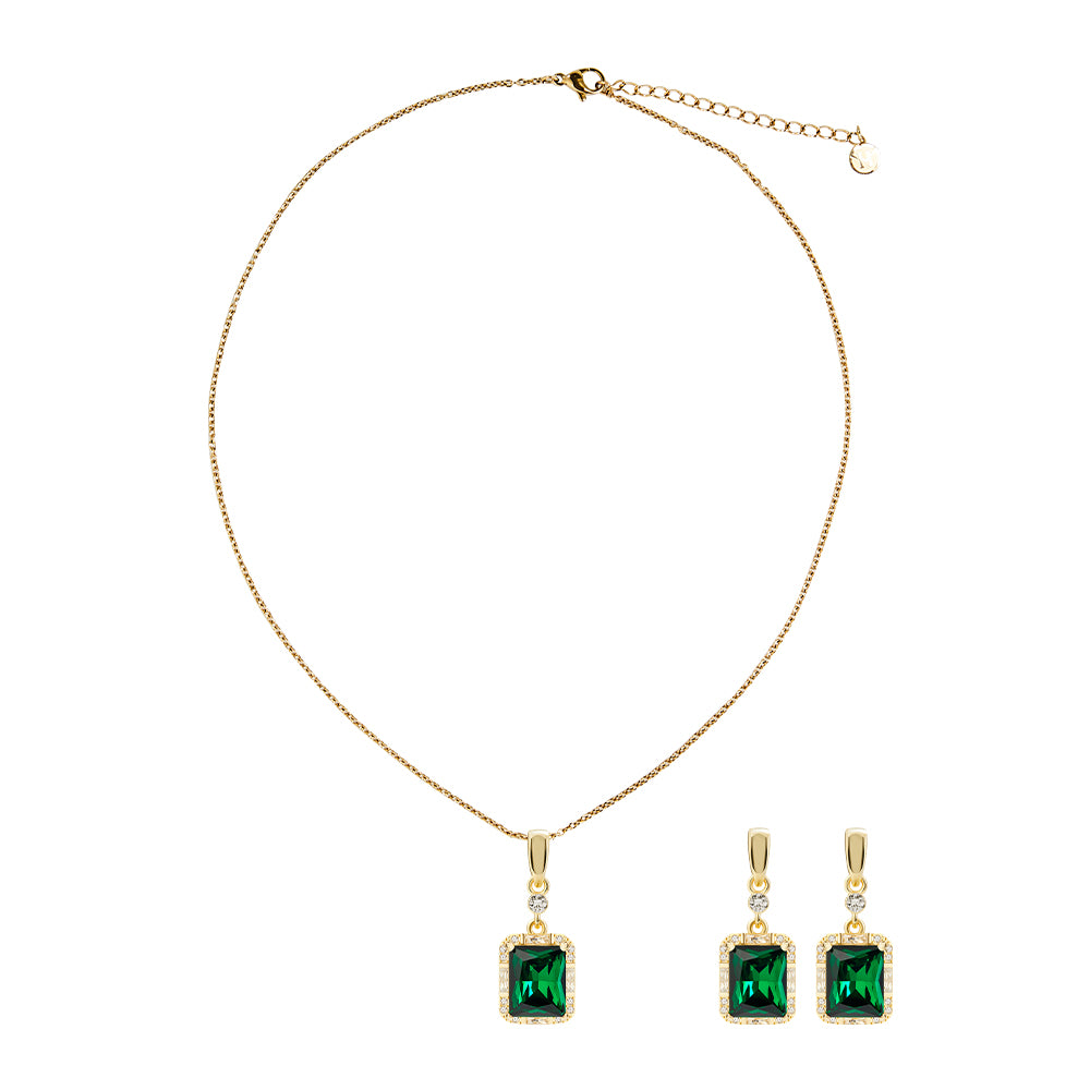 Victoria Hyde London jewelry set with light gold necklace and earrings, featuring deep green rectangular stones. Elegant, glamorous design for daily or special occasions.