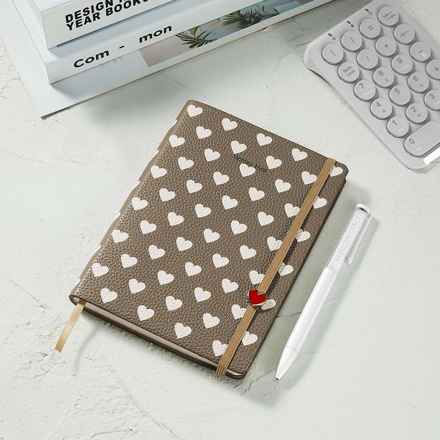 Victoria Hyde heart-embossed leather notebook with crystal pen gift set.

