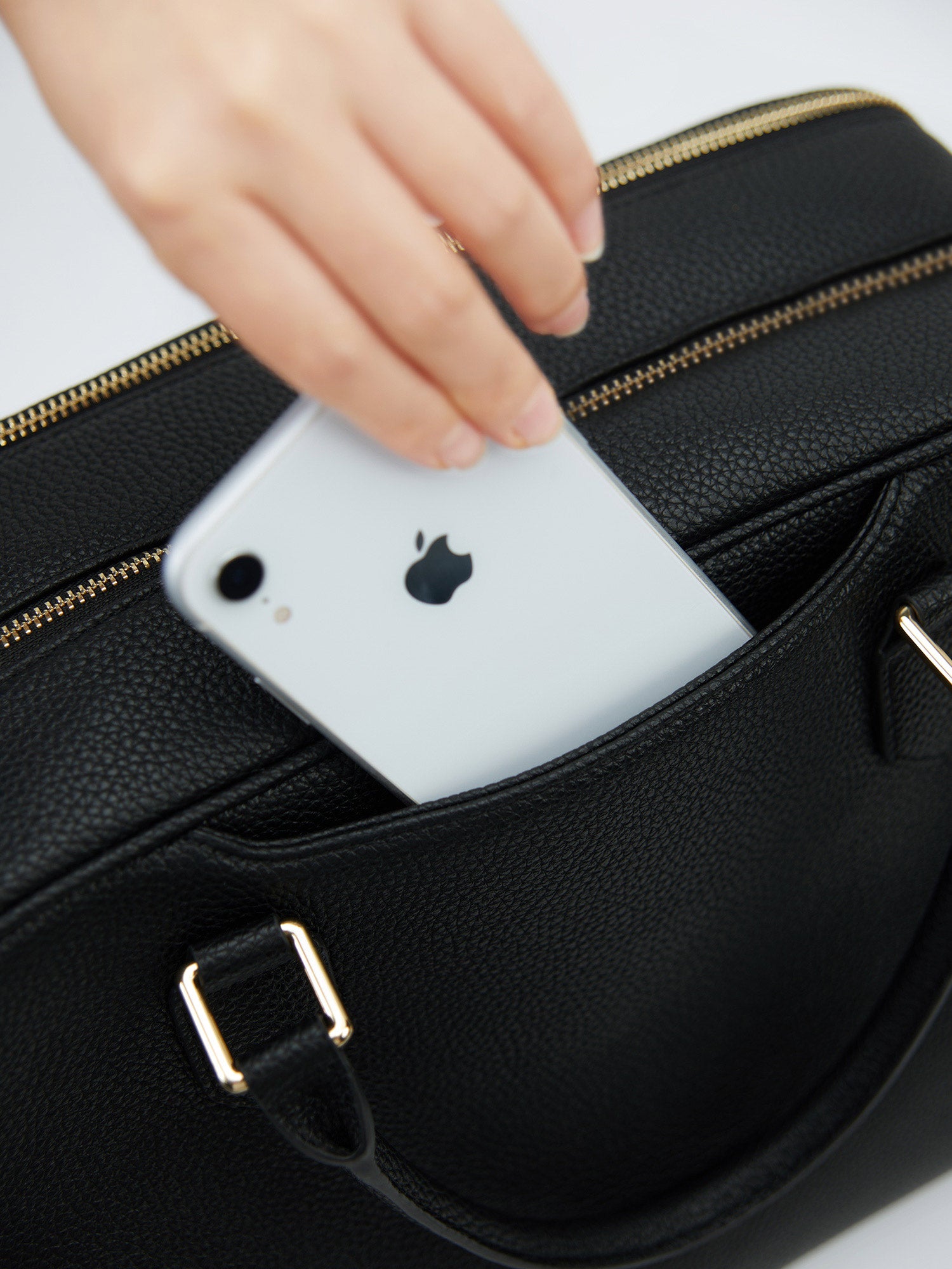Victoria Hyde Amal-black laptop bag featuring a convenient front pocket for quick access to your smartphone, perfect for busy professionals on the go.