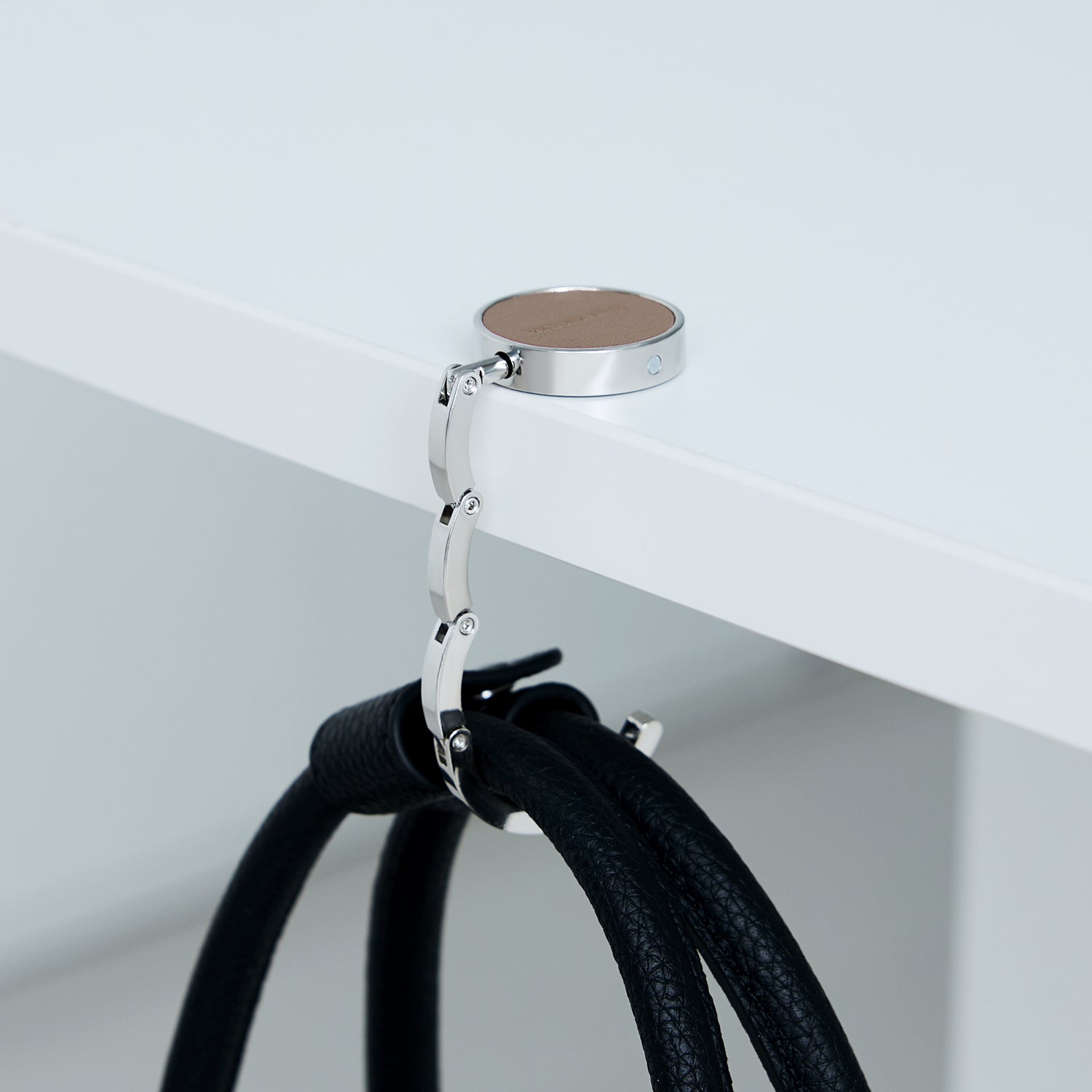 Victoria Hyde London Abigail anti-slip bag hook – compact microfiber, steel, and silicone design (43.5 mm, 32.9 g) for secure, scratch-free hanging on tables.