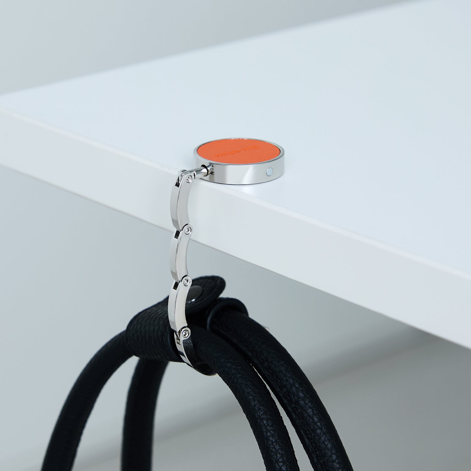 Victoria Hyde London Abigail anti-slip bag hook – compact microfiber &amp; steel design with silicone grip. Lightweight, scratch-free, perfect for desks or restaurants.