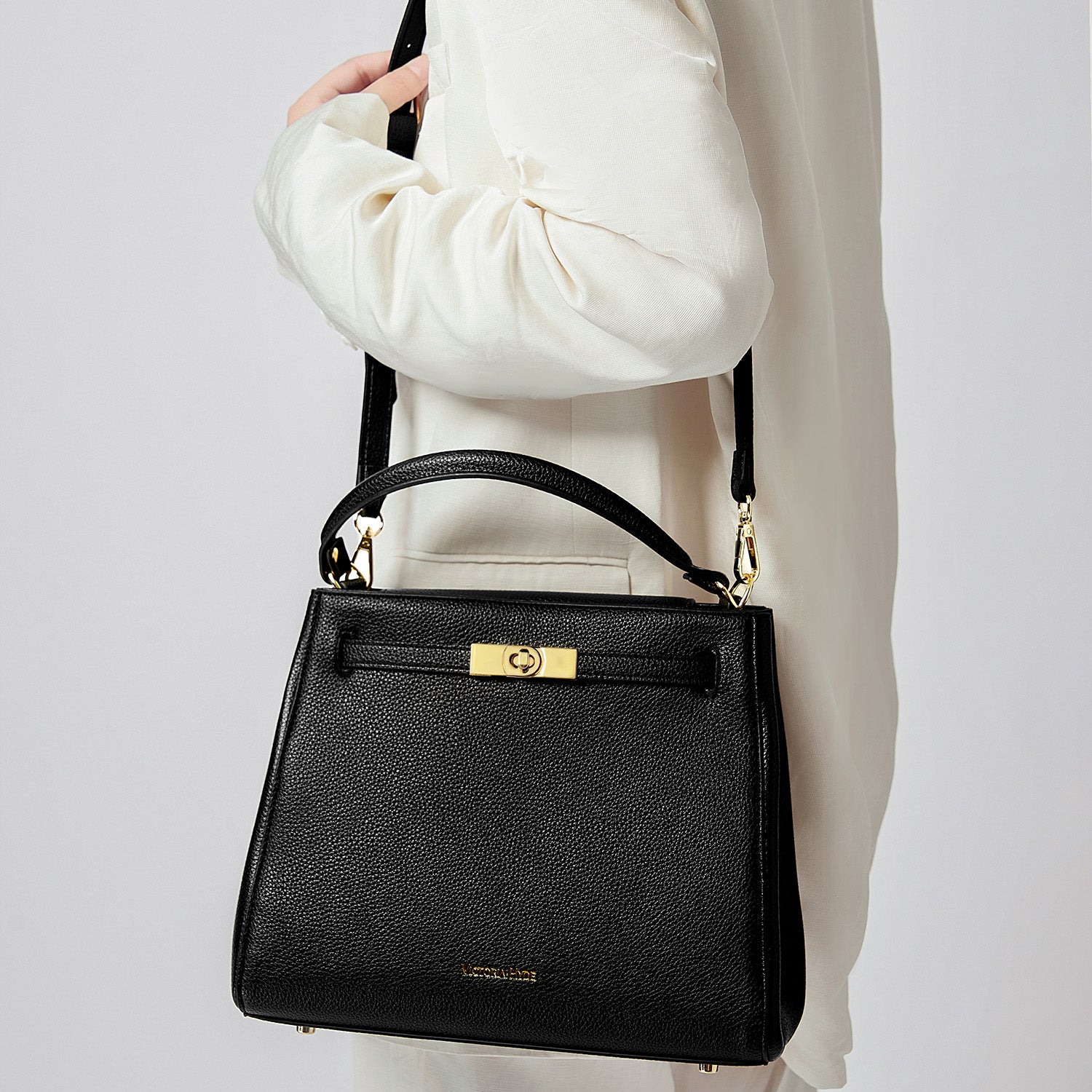 Victoria Hyde Victoria III work shoulder bag – trapezoid PU leather, gold closure, lightweight 0.7kg, fits 12.9" tablet, organizer pockets, 28x23x11 cm.