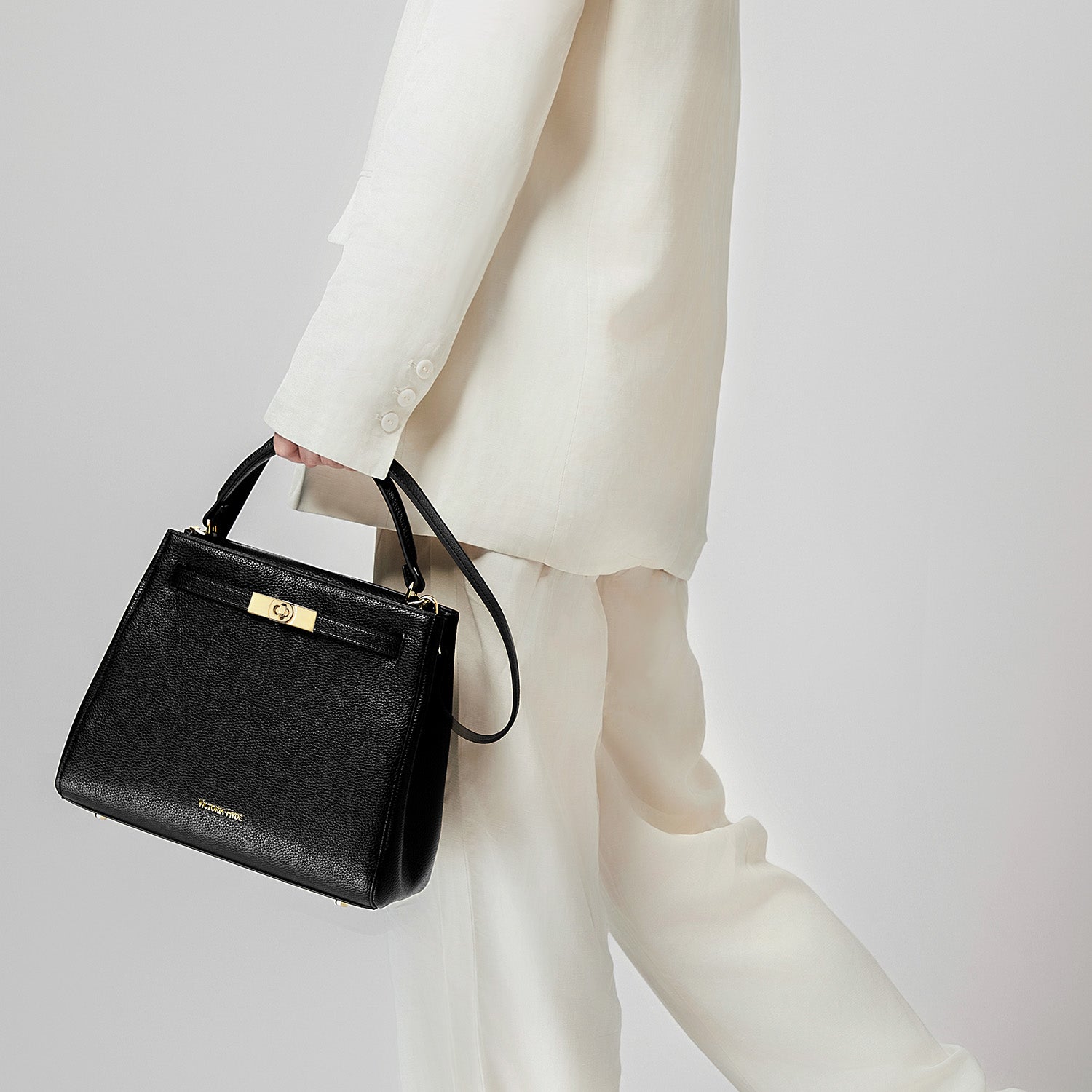 Victoria Hyde Victoria III work shoulder bag – trapezoid PU leather, gold closure, lightweight 0.7kg, fits 12.9" tablet, organizer pockets, 28x23x11 cm.