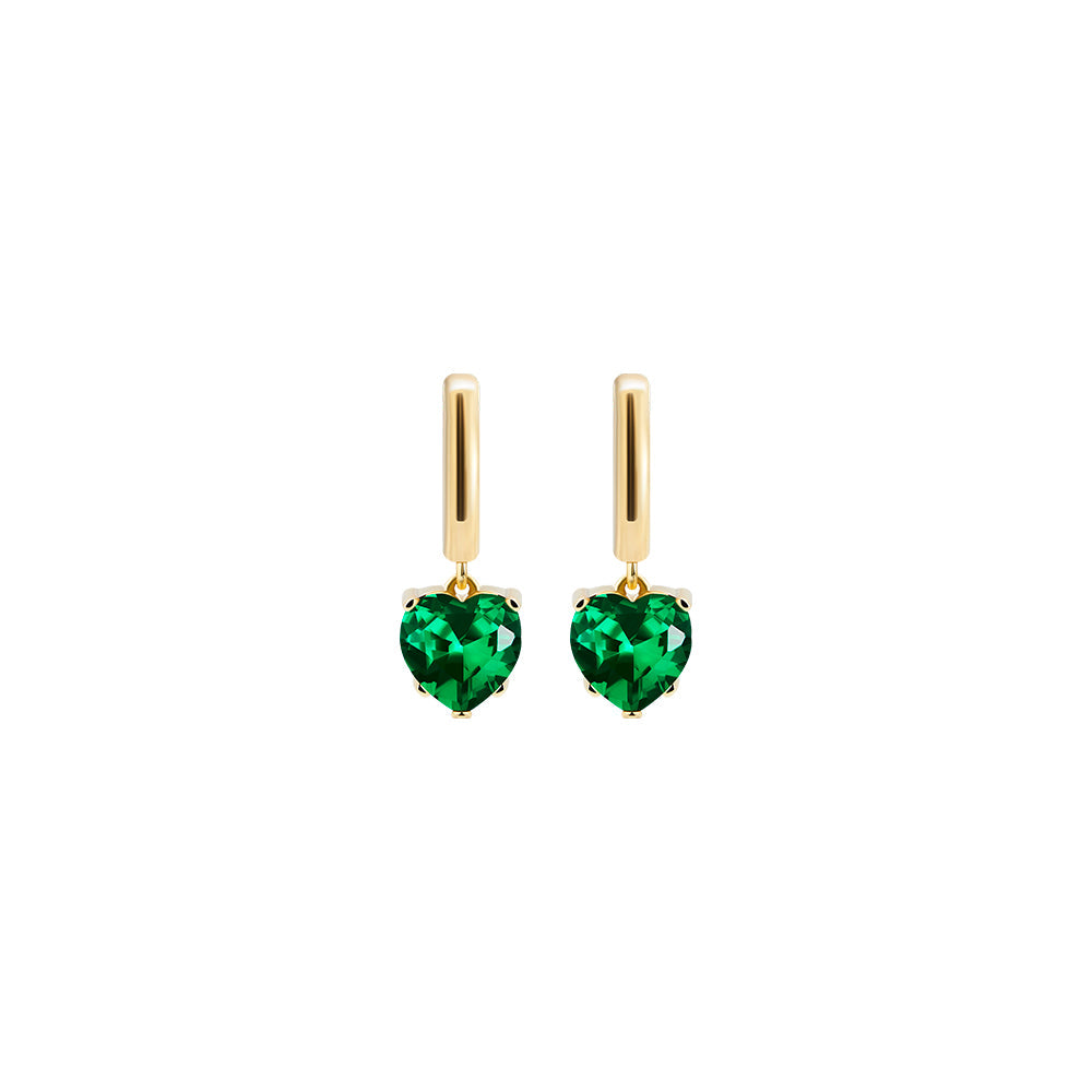 Victoria Hyde London heart-shaped jewelry set: necklace and earrings, light gold with deep green stones. Elegant, luxurious accessory for a refined look.