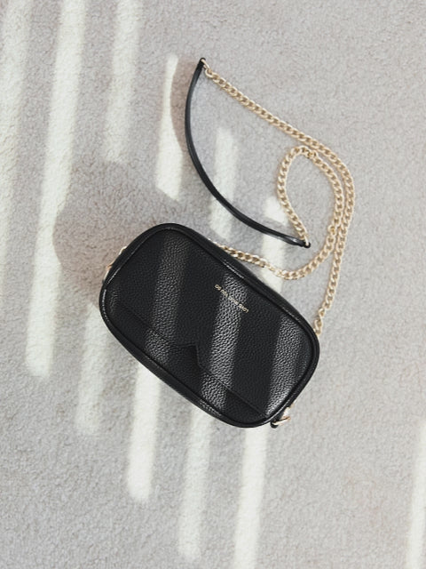 Victoria Hyde Antonia Black crossbody bag – packing video showing compact interior with key pocket, lipstick pocket, card slot and headphone compartment.
