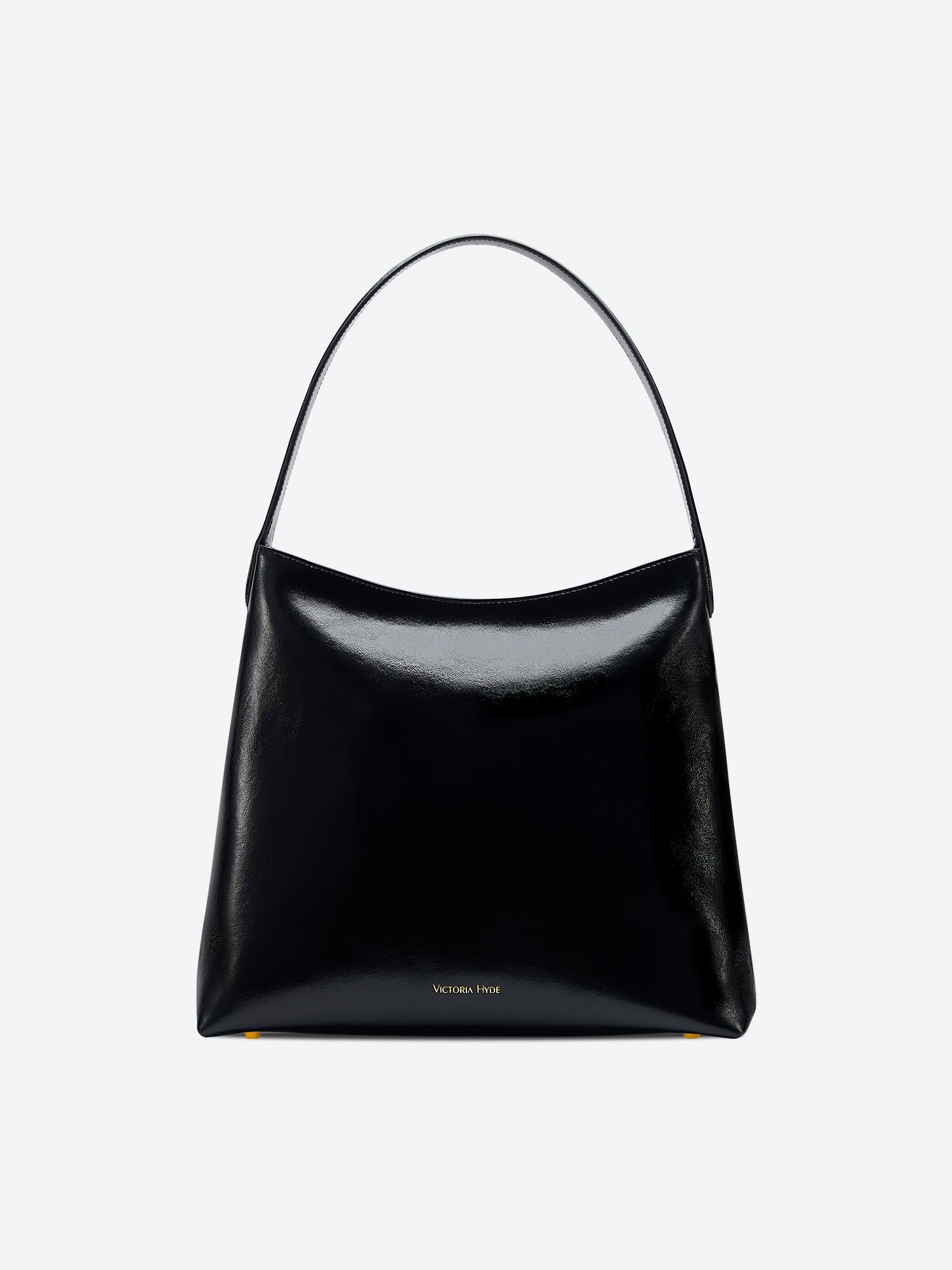 Victoria Hyde shoulder bag, microfiber leather, recycled lining. Padded sunglasses compartment, trolley strap, light gold hardware. “Love what you do” detail.