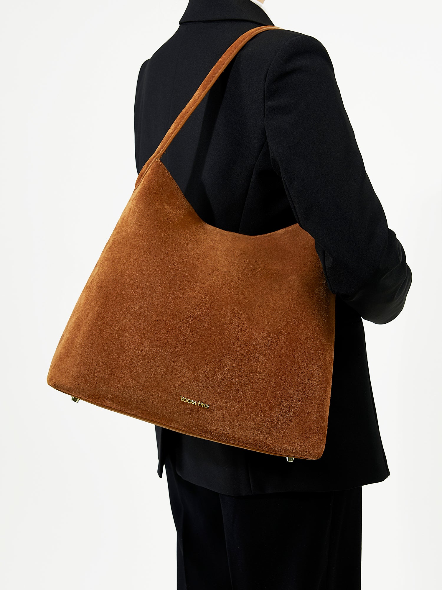 Victoria Hyde shoulder bag, split leather with recycled lining, multifunctional interior for phone, sunglasses, lipstick, keys, plus trolley strap and external zip pocket.