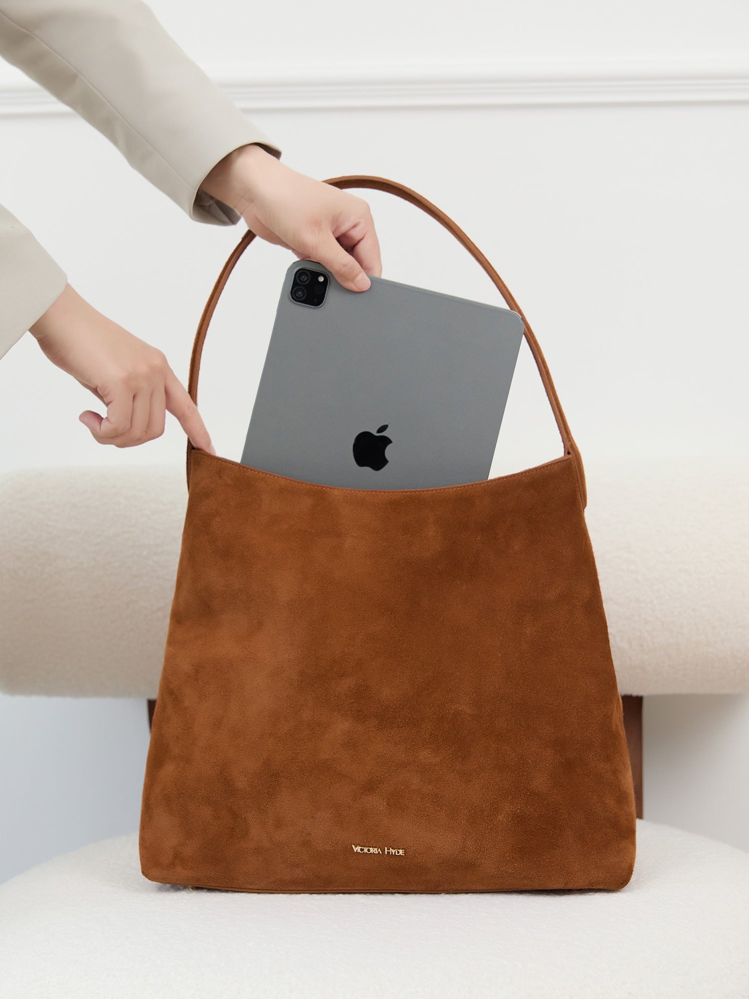 Victoria Hyde shoulder bag, split leather with recycled lining, multifunctional interior for phone, sunglasses, lipstick, keys, plus trolley strap and external zip pocket.