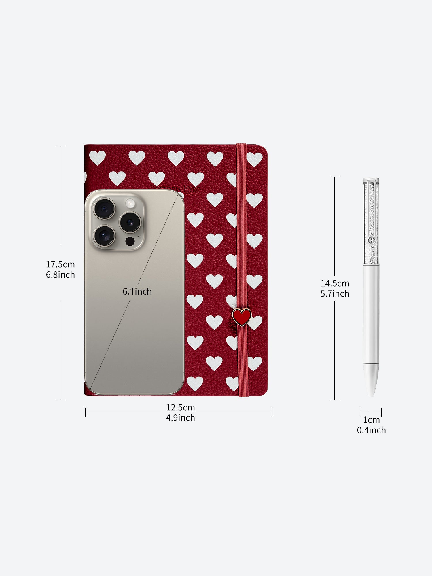 Size dimensions of Victoria Hyde Anna notebook in red and matching white crystal pen, showing measurements in centimeters and inches for reference.