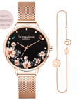 roségoldene Uhr mit schwarzem Ziffernblatt und Blumenmuster