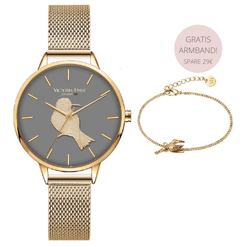 goldene Armbanduhr mit 3D Vogel auf dem Ziffernblatt und passenden Armband